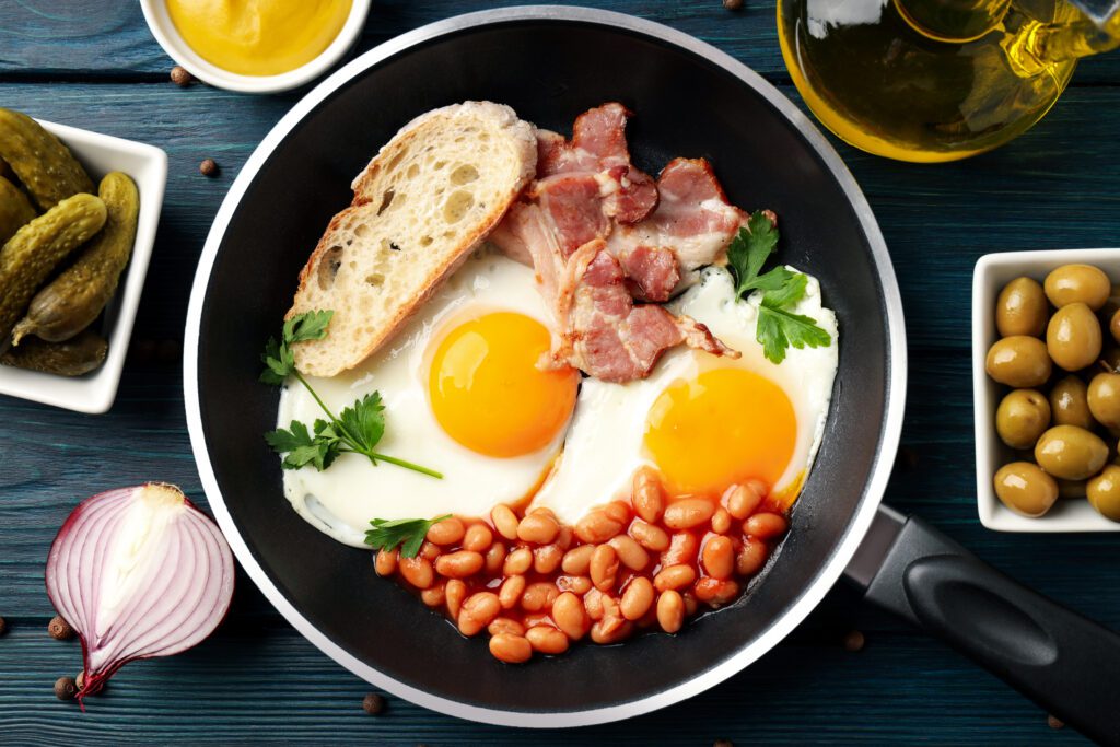 Concept of tasty breakfast on wooden background