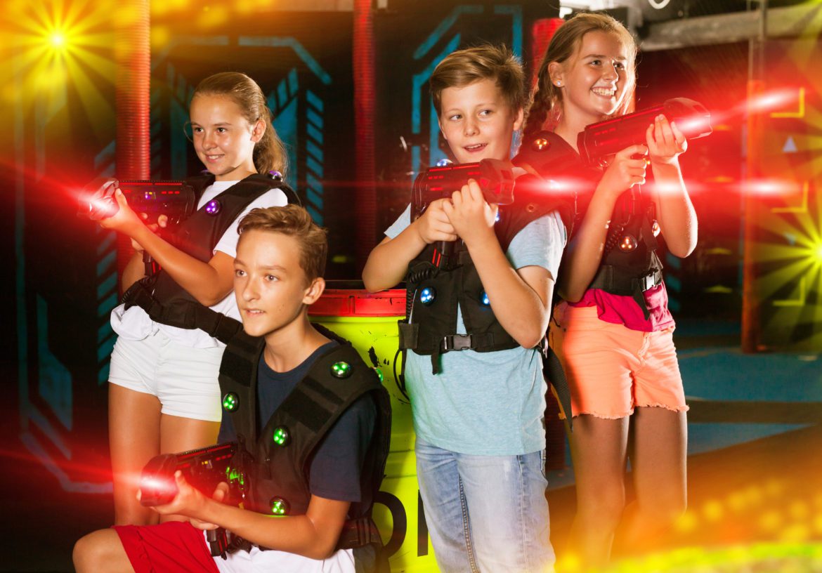 Cheerful,Teen,Girls,And,Boys,With,Laser,Pistols,Posing,Together laser tag melbourne