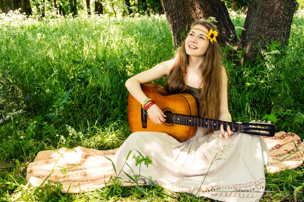 Hippie,Ethnic,Smiling,Girl,Singer,With,Guitar,In,The,Forest life coach scam